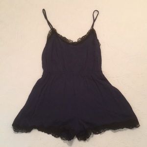 F21 navy romper with black lace trim. Size Medium